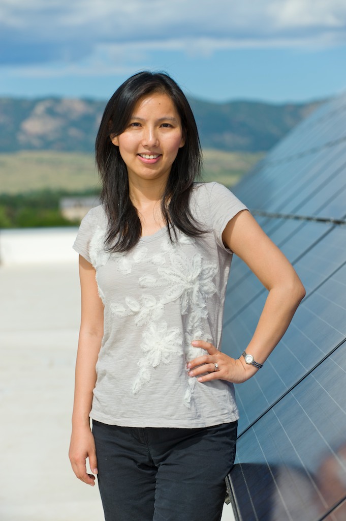 Liuqing Yang, Associate Professor of Electrical and Computer Enginering, with the solar power array on the roof of the Behavioral Sciences Building at Colorado State University, August 4, 2011